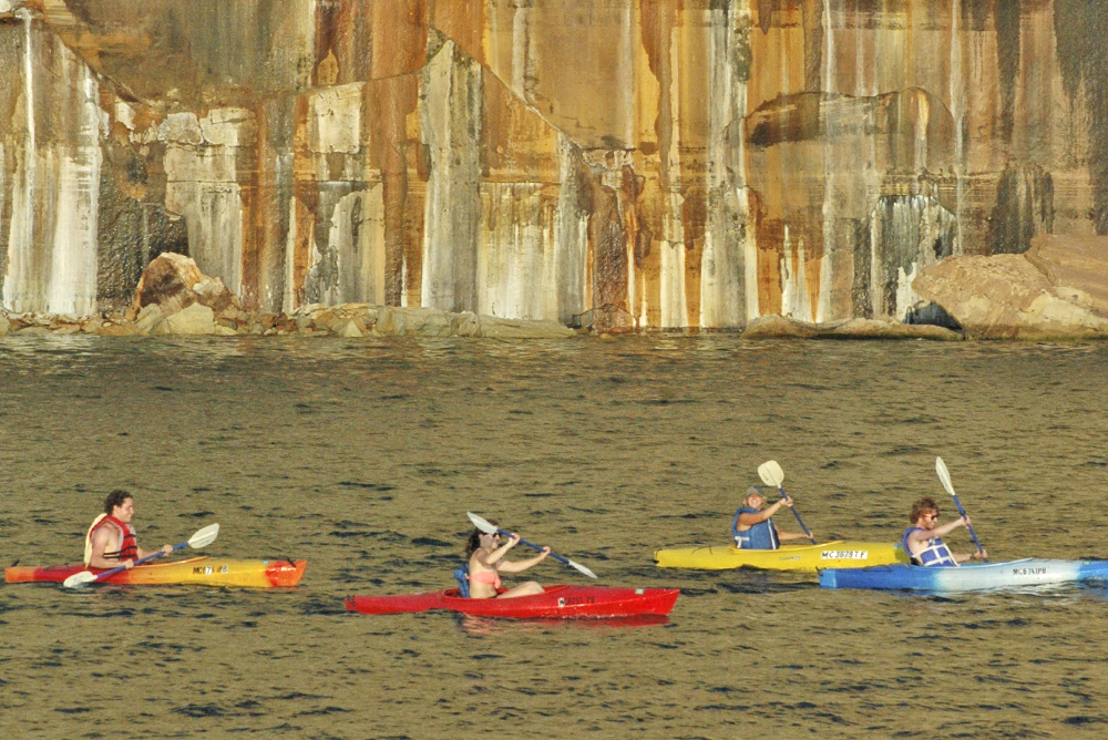 Kayakers in Lake Superior along the Pictured Rocks.